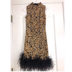 Gold sequence and black feather dress😍